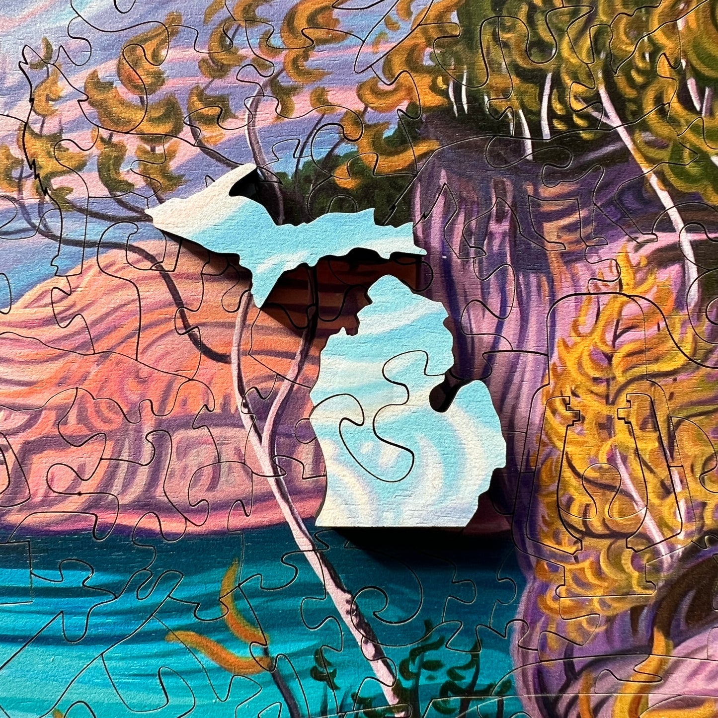 Close up of a section of the Perfect Creation artwork showing a natural arch formation along the Pictured Rocks shoreline.