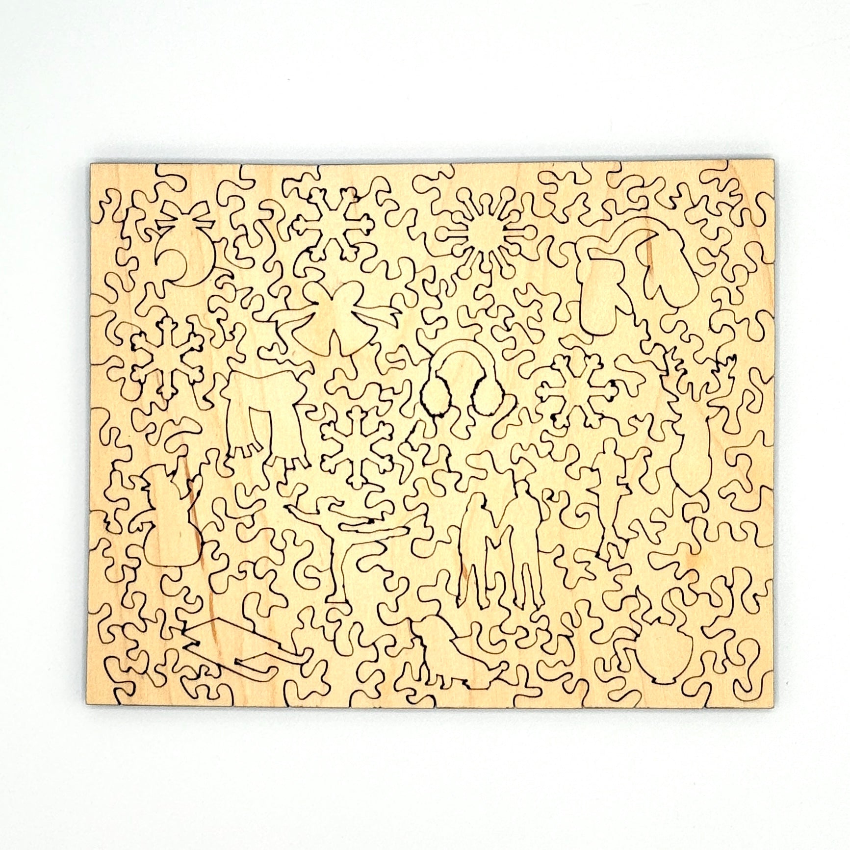 Back view of the Downtown Ice Skating wooden puzzle pieces showing the laser cut shapes.