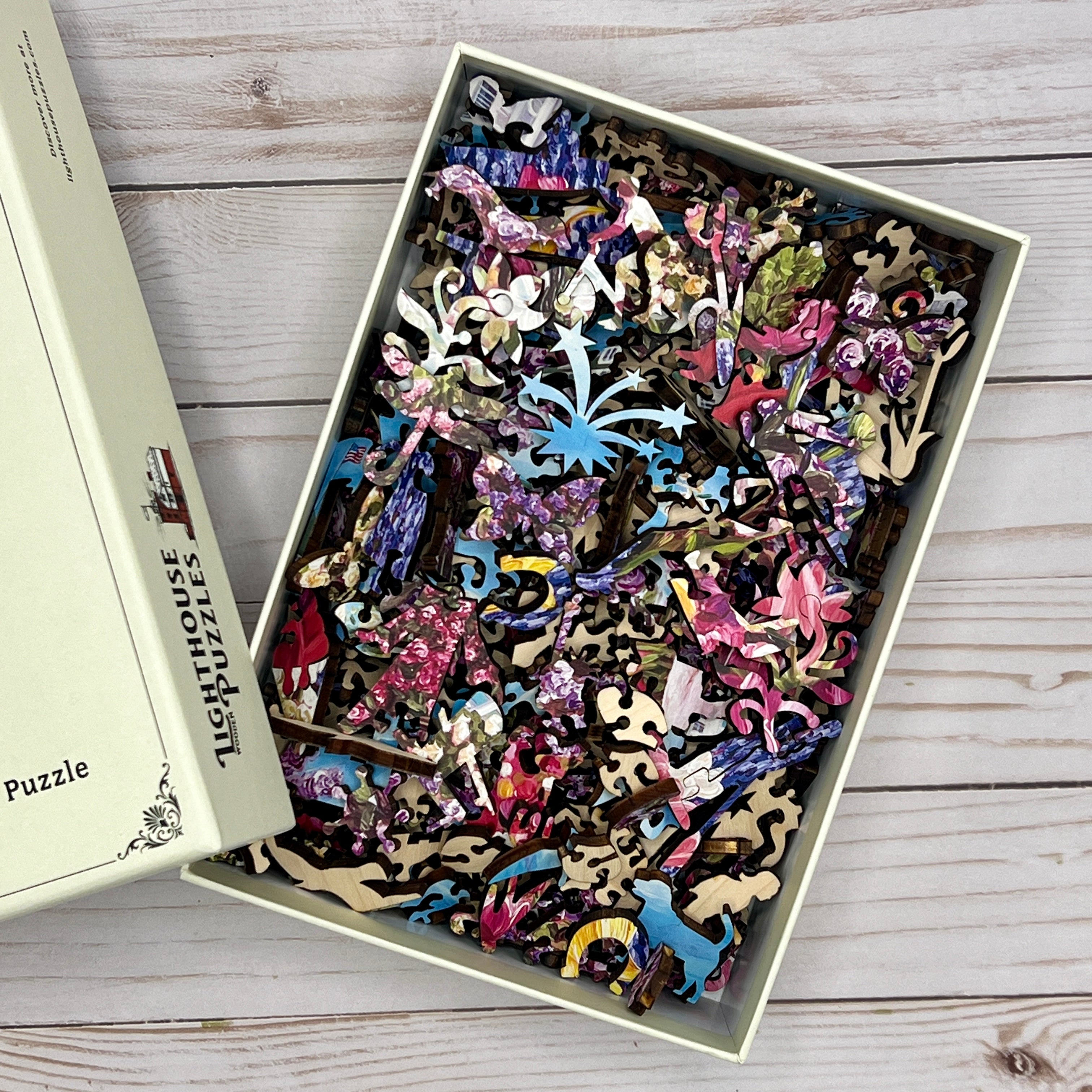 A box full of wooden puzzle pieces with the top removed.