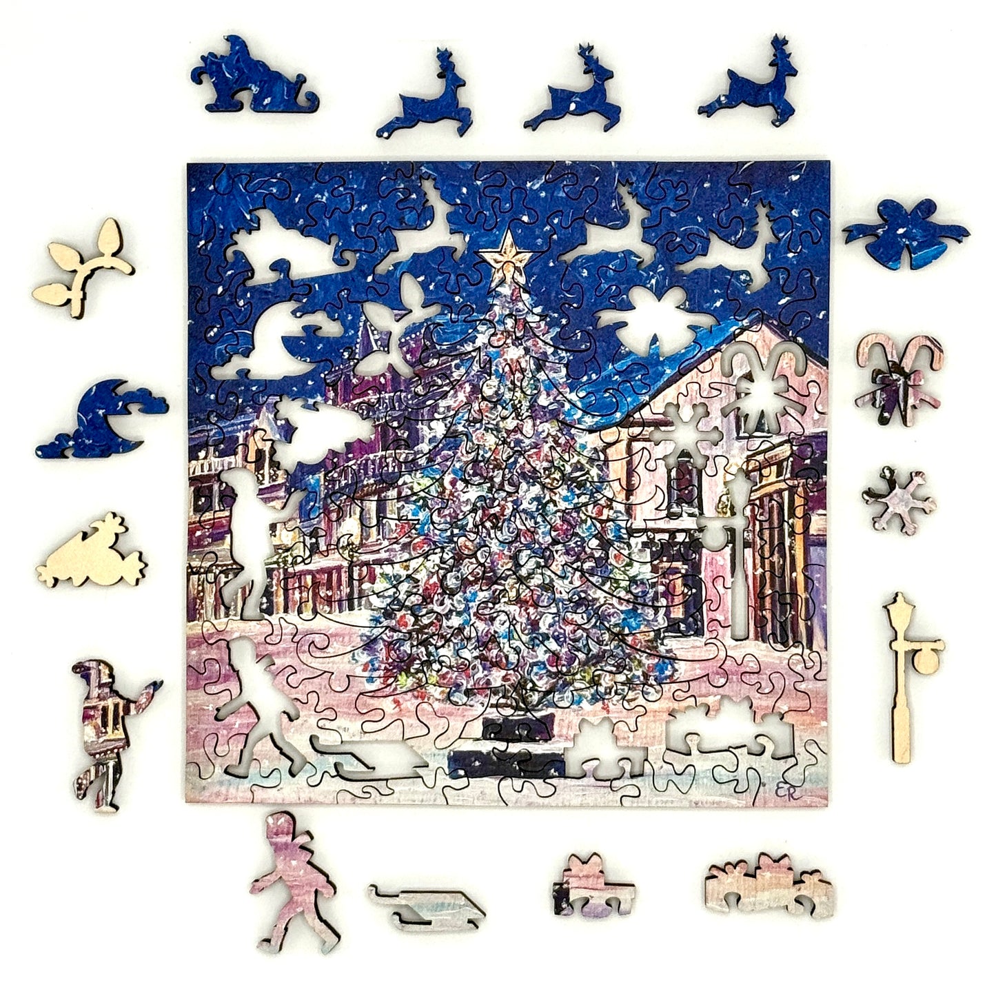 Mackinac Christmas Tree wooden Christmas puzzle with whimsy pieces displayed around the artwork.