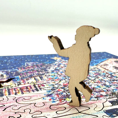 Close up view of a wooden figure piece from the Mackinac Christmas Tree holiday puzzle.