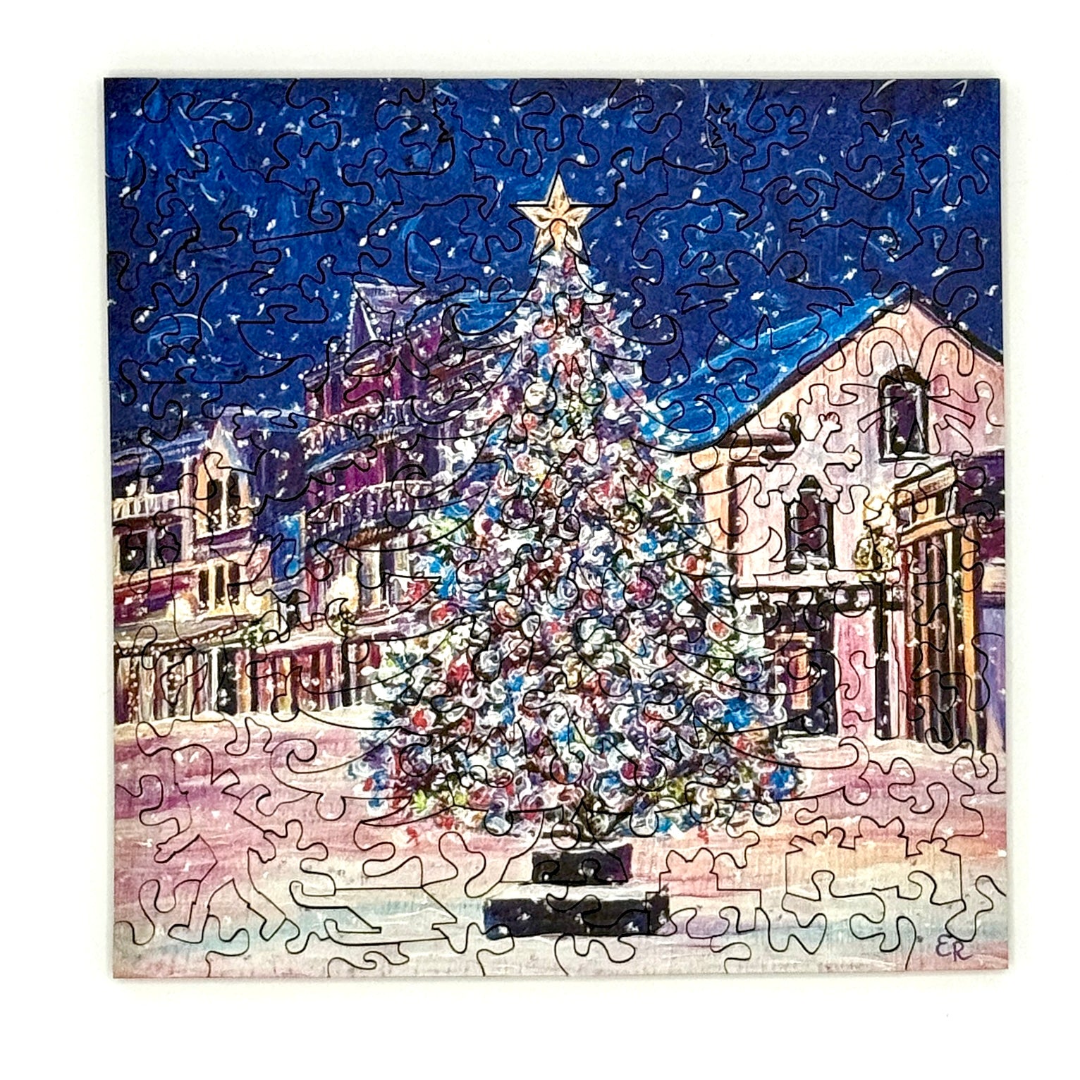 Completed Mackinac Christmas Tree wooden Christmas puzzle showing a festive winter scene on Mackinac Island.